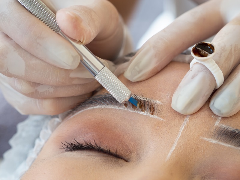 young woman going through microblading procedure